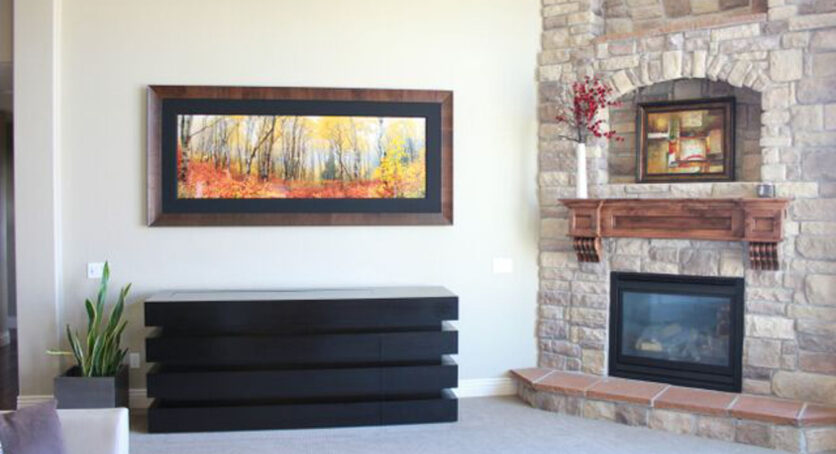 Cabinet Tronix Le Bloc buffet in living room next to fire place has TV lift kit to hide flat screen