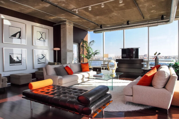 Le Bloc hidden TV lift furniture in high rise next to window by Cabinet-Tronix