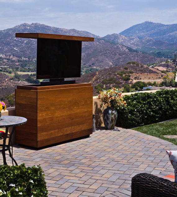 Backyard TV lift cabinet hides 55 inch TV & sound bar made out of Cumaru IPE Poway California Cabinet Tronix