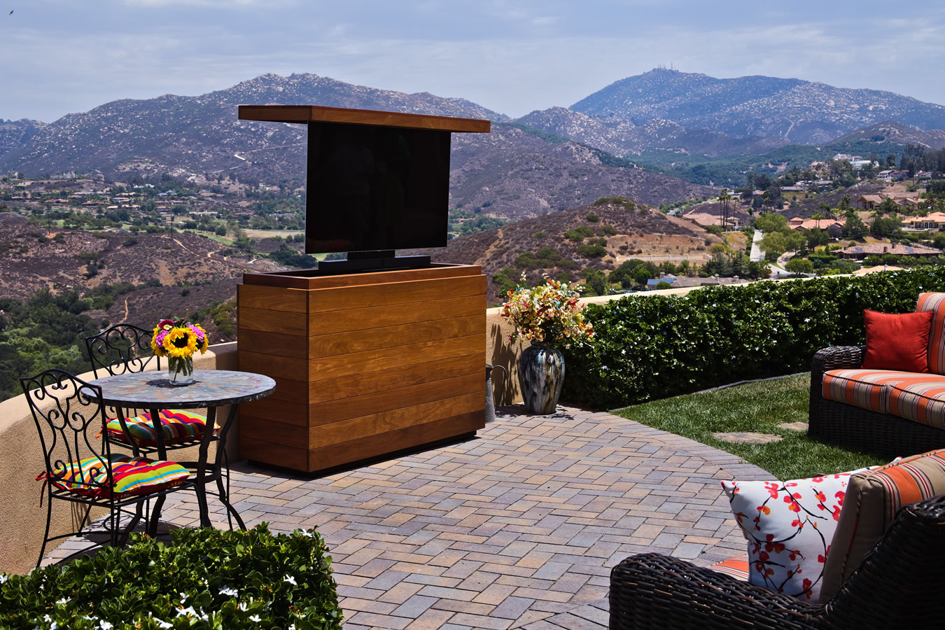 Backyard TV lift cabinet hides 55 inch TV & sound bar made out of Cumaru IPE Poway California Cabinet Tronix