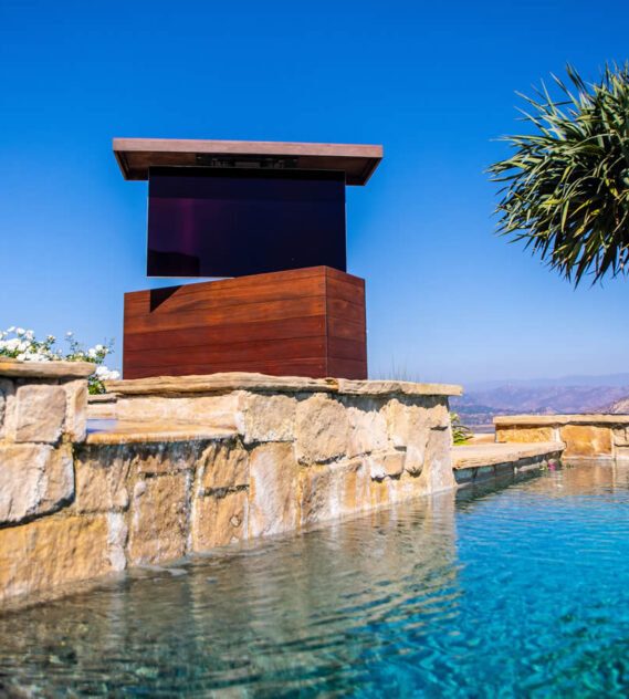 T-Top Cumaru outdoor TV lift furniture by the pool spa and sitting area