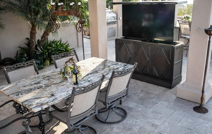 Beautiful-outdoor-living-backyard-has-custom-TV-lift-furniture-cabinet