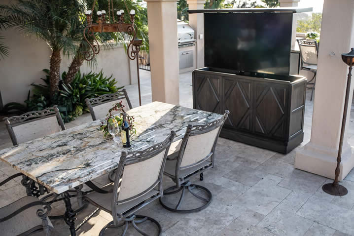 Beautiful-outdoor-living-backyard-has-custom-TV-lift-furniture-cabinet
