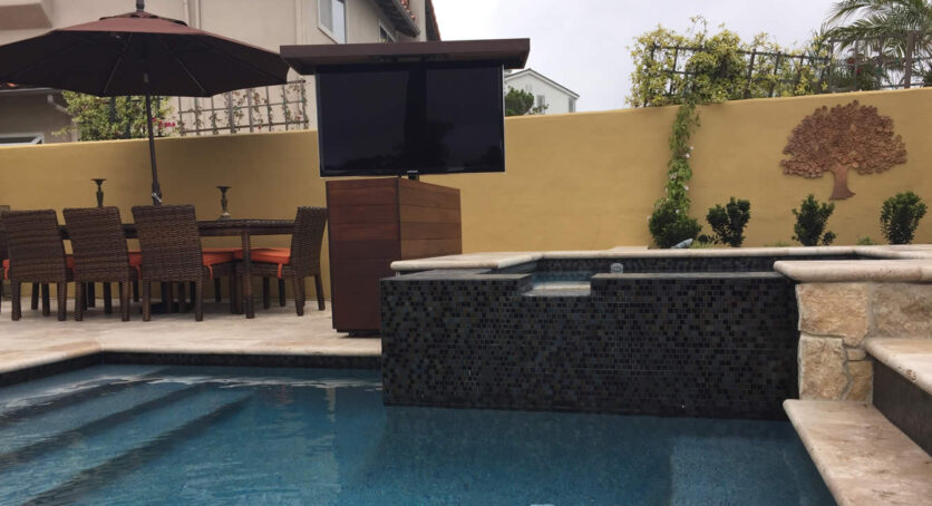 Watch waterproof TV from pool and jacuzzi in back yard with TV lift cabinet Seattle