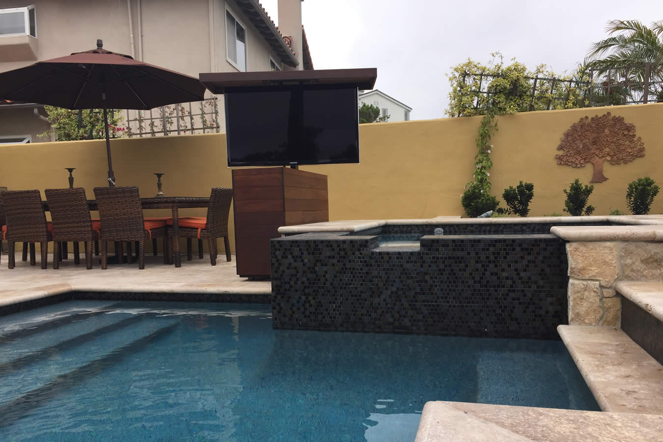 Watch waterproof TV from pool and jacuzzi in back yard with TV lift cabinet Seattle