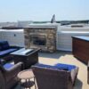 tv hidden in lift cabinet on rooftop patio outside