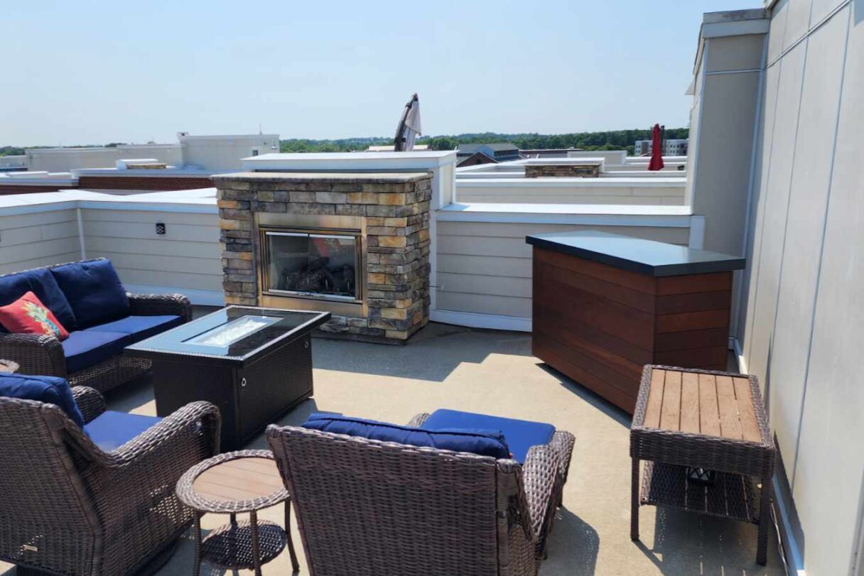 tv hidden in lift cabinet on rooftop patio outside 2