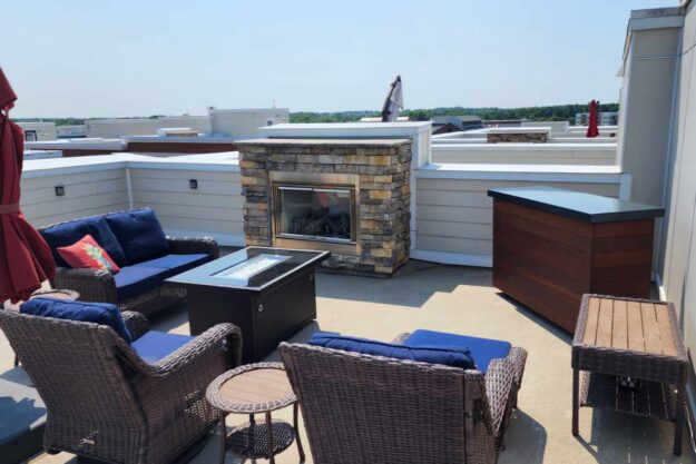 tv hidden in lift cabinet on rooftop patio outside