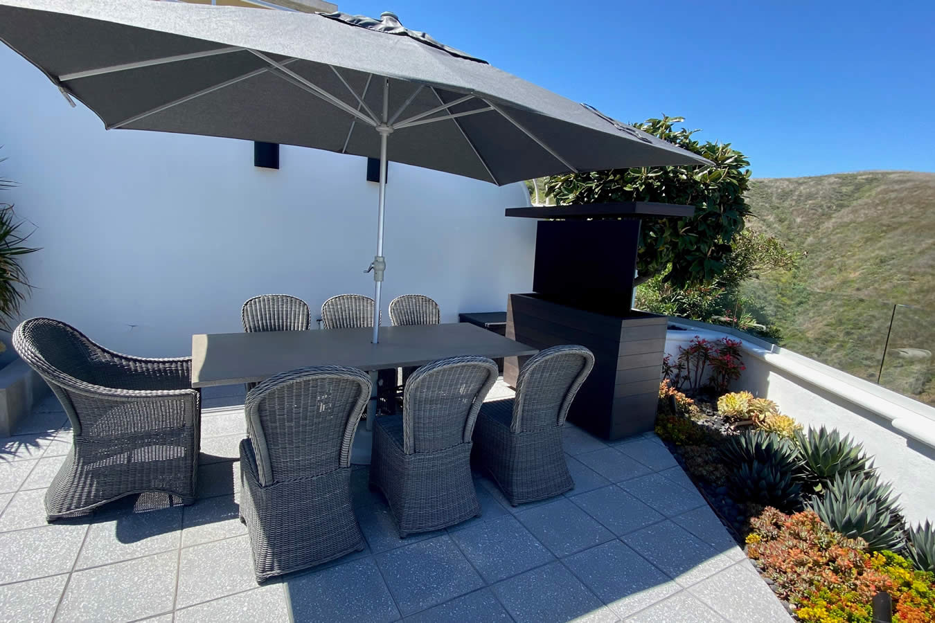 Watching TV outside by dining table with Cabinet Tronix hidden pop up TV lift cabinet Utah