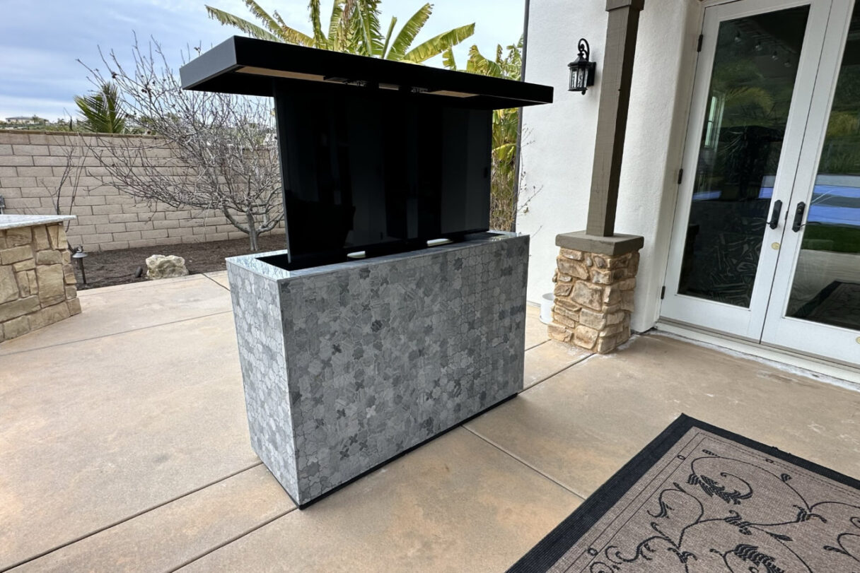 motorized remote lift hides protects otudoor tv patio