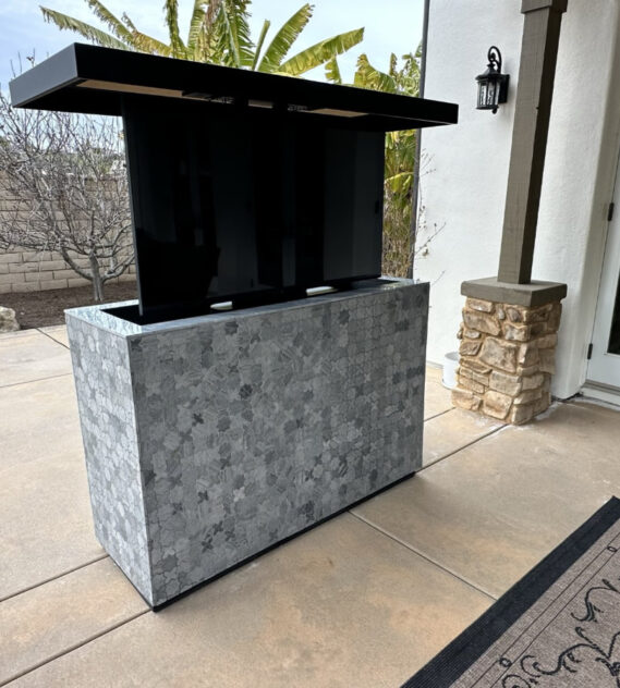 motorized remote lift hides protects otudoor tv patio
