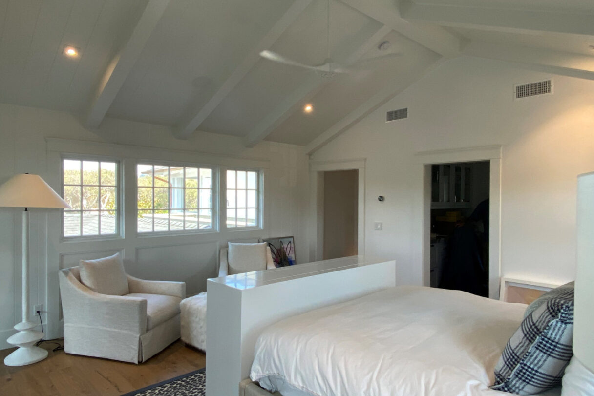 foot of bed with tv hiding in cabinet