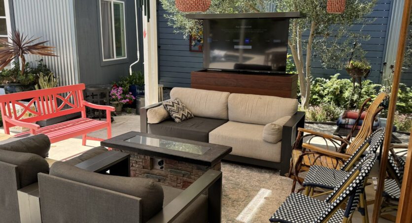 outdoor tv lift cabinet hides tv behind couch