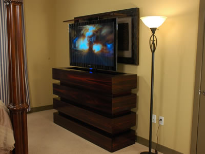 55 inch tv in bedroom rises out of contemporary le bloc - cabinet-tronix